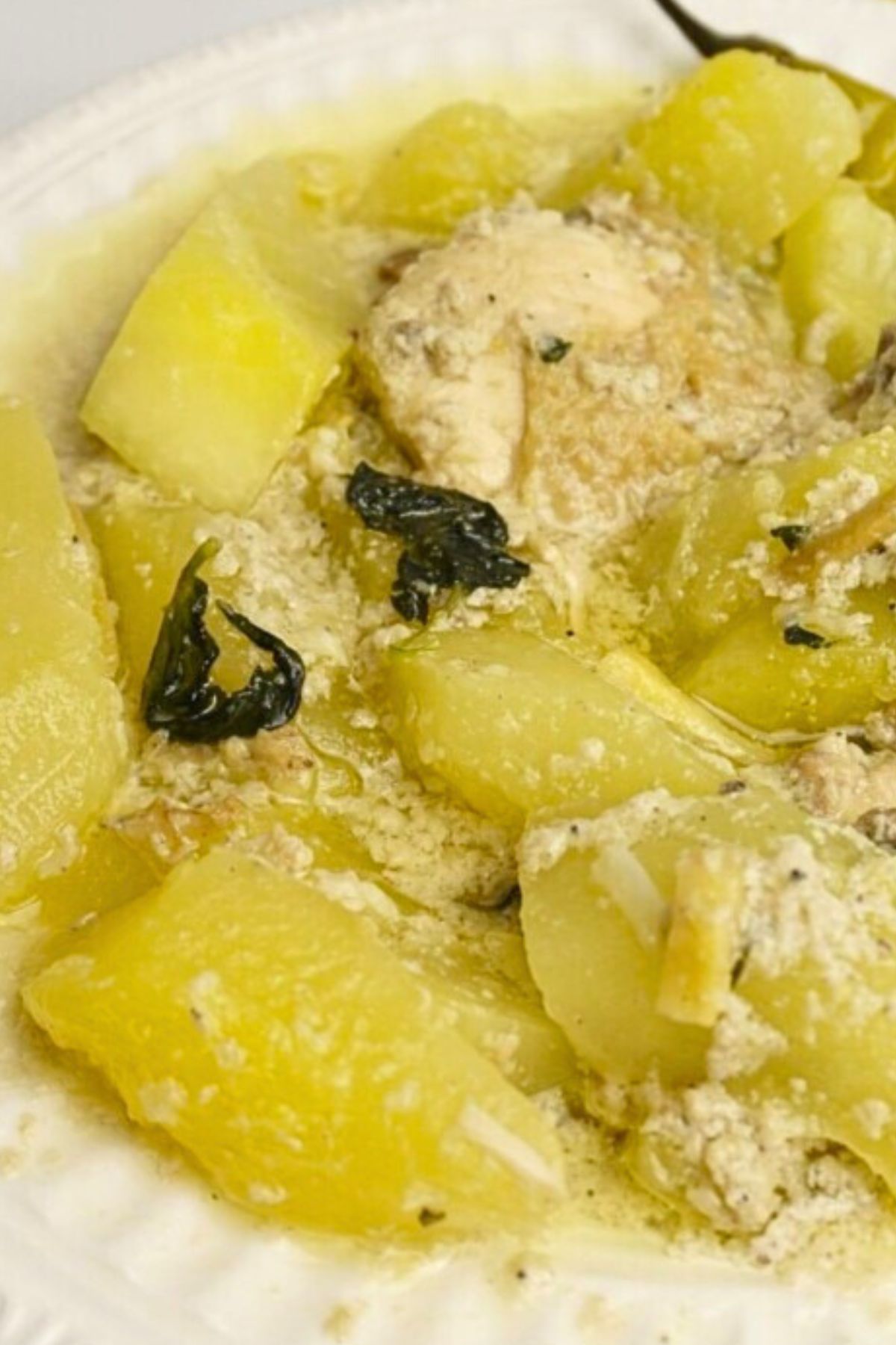 Creamy ginataang papaya served in a white plate.
