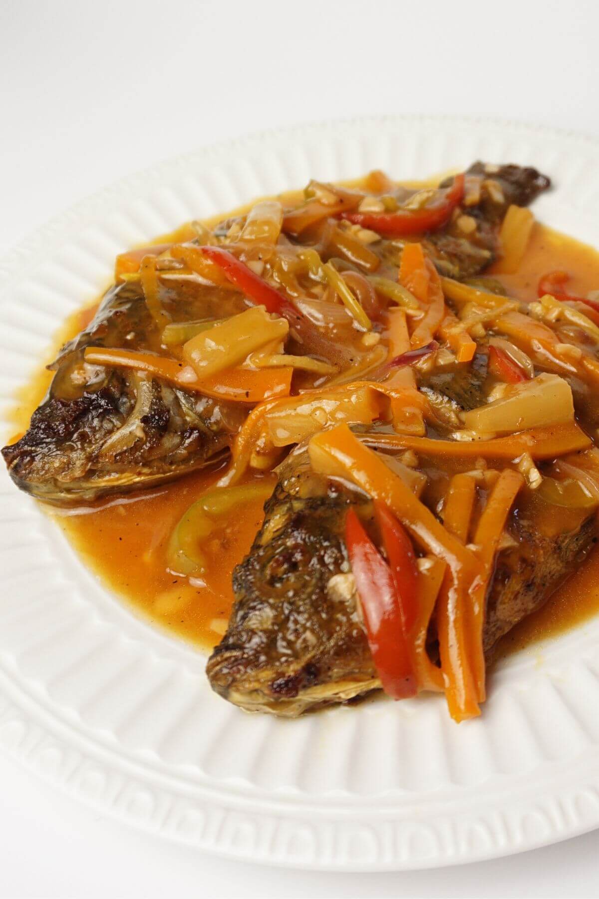 Sweet and sour tilapia in plate.