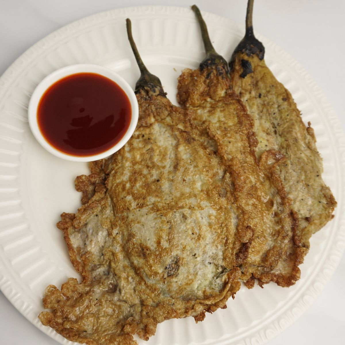 Fried tortang talong on close-up.