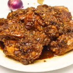 Serving of chicken adobo in plate